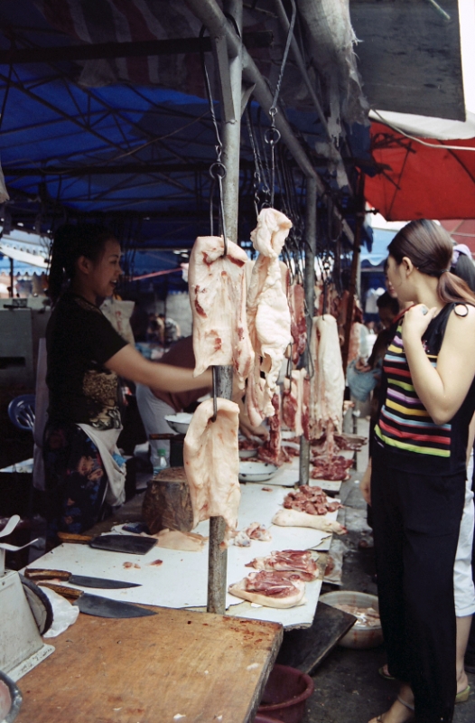 Open-air market butcher, Chengdu China.jpg